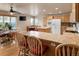Open kitchen with an island, eat-in breakfast nook, and stainless steel appliances at 20995 County Road 28, Hudson, CO 80642