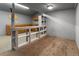Inside room, cabinets, shelving and gray walls with carpeting and a beam showing the room is a remodel at 20995 County Road 28, Hudson, CO 80642