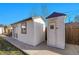 View of two backyard sheds, one featuring french doors and the other with a single entry door at 248 S 5Th Ave, Brighton, CO 80601