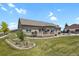 Expansive backyard featuring a well-maintained lawn, a charming deck, and tasteful landscaping elements at 4714 Carmichael Ct, Brighton, CO 80603