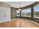Charming dining room featuring hardwood floors, a modern light fixture, and plenty of natural light at 4714 Carmichael Ct, Brighton, CO 80603