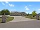 Beautiful single-story home with manicured lawn and decorative stone entrance pillars at 4714 Carmichael Ct, Brighton, CO 80603