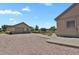 Spacious garage with ample parking, additional storage, and a neatly graveled driveway at 4714 Carmichael Ct, Brighton, CO 80603