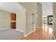 Spacious interior view showing the hardwood floors, neutral wall colors, and a built-in wet bar at 4714 Carmichael Ct, Brighton, CO 80603