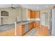 Open kitchen with granite countertops, stainless steel appliances, and views of the spacious living area at 4714 Carmichael Ct, Brighton, CO 80603