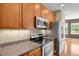 Well-equipped kitchen with stainless steel appliances, granite countertops, and ample storage space at 4714 Carmichael Ct, Brighton, CO 80603