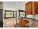 Stylish kitchen with granite counters and stainless steel appliances seamlessly connecting to the sunny dining area at 4714 Carmichael Ct, Brighton, CO 80603