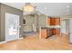 Open-concept layout connecting the kitchen and living room, creating a seamless flow for modern living at 4714 Carmichael Ct, Brighton, CO 80603