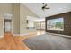 Spacious living area with hardwood floors, a wet bar, and an open concept layout at 4714 Carmichael Ct, Brighton, CO 80603