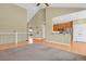 Bright and airy living area showcasing an open layout leading to the kitchen, perfect for entertaining at 4714 Carmichael Ct, Brighton, CO 80603