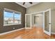 Inviting office space featuring wood floors, natural light, and a seamless transition to other spaces at 4714 Carmichael Ct, Brighton, CO 80603