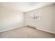 This empty bedroom has neutral walls, new carpeting, and a window that lets in ample light at 14602 E 2Nd Ave # 200C, Aurora, CO 80011