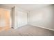 Bedroom featuring neutral walls, carpeting, and large closet at 14602 E 2Nd Ave # 200C, Aurora, CO 80011