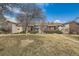 A serene view of well-maintained apartment buildings surrounded by mature trees and a neatly trimmed lawn at 14602 E 2Nd Ave # 200C, Aurora, CO 80011