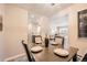 The dining room is situated between the kitchen and the living room with coordinated decor at 14602 E 2Nd Ave # 200C, Aurora, CO 80011