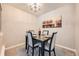 Cozy dining room with modern lighting and decor adjacent to the kitchen area at 14602 E 2Nd Ave # 200C, Aurora, CO 80011