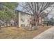 Multi-level condo with brick and siding, featuring wooden balconies and mature trees surrounding at 14602 E 2Nd Ave # 200C, Aurora, CO 80011