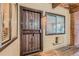 The building entrance with security door and window welcomes visitors with comfort and protection at 14602 E 2Nd Ave # 200C, Aurora, CO 80011