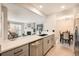 Open-concept kitchen with stainless steel appliances and views into the living room and dining area at 14602 E 2Nd Ave # 200C, Aurora, CO 80011