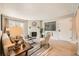 Comfortable living room with fireplace and an open concept, lots of natural light at 14602 E 2Nd Ave # 200C, Aurora, CO 80011