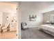 Bright main bedroom with neutral decor, ensuite bathroom, and sitting area at 14602 E 2Nd Ave # 200C, Aurora, CO 80011