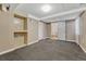 Spacious basement with painted walls, foam flooring, and doorway to the bathroom at 3201 S Pearl St, Englewood, CO 80113