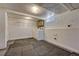 Basement laundry area with a washer, dryer, wire rack shelving, and painted walls at 3201 S Pearl St, Englewood, CO 80113