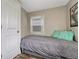 Small bedroom featuring a twin bed, neutral decor, and a window with natural light at 3201 S Pearl St, Englewood, CO 80113
