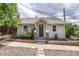Charming home with gray siding, a cozy front porch, and well-maintained landscaping at 3201 S Pearl St, Englewood, CO 80113
