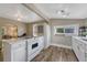 Bright kitchen featuring modern appliances and ample counter space with connection to dining area at 3201 S Pearl St, Englewood, CO 80113