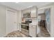 Bright kitchen featuring stainless steel appliances, granite countertops, and neutral gray cabinetry at 3201 S Pearl St, Englewood, CO 80113