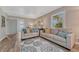 Spacious living room with couches, decorative rug and pillows, and natural light at 3201 S Pearl St, Englewood, CO 80113