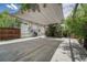 Spacious concrete patio with pergola and canvas sunshade, offering ample outdoor living space at 3201 S Pearl St, Englewood, CO 80113