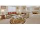 Spacious basement with comfortable seating and adjacent bedroom area at 12348 W Gould Ave, Littleton, CO 80127