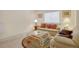 Spacious finished basement with comfortable seating and carpeted floor at 12348 W Gould Ave, Littleton, CO 80127