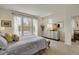 Bedroom with dresser and mounted television, and bright natural light at 12348 W Gould Ave, Littleton, CO 80127