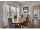 Bright dining room with large windows, hardwood floors, and modern decor at 12348 W Gould Ave, Littleton, CO 80127