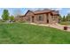 Exterior shot of well-maintained home featuring manicured lawn and landscaping at 12348 W Gould Ave, Littleton, CO 80127