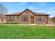 Charming front yard with a lush lawn and inviting curb appeal at 12348 W Gould Ave, Littleton, CO 80127