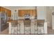 Modern kitchen featuring a large island with seating and stainless steel appliances at 12348 W Gould Ave, Littleton, CO 80127