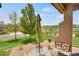 Covered patio with ample seating overlooks the beautiful, expansive and green lawn at 12348 W Gould Ave, Littleton, CO 80127