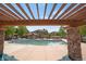 View of community pool with stone columns, pergola and surrounding buildings at 12348 W Gould Ave, Littleton, CO 80127
