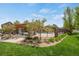 Community pool with pergola, stone columns, and manicured lawn area at 12348 W Gould Ave, Littleton, CO 80127