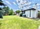 Expansive backyard featuring mature trees and a well-manicured lawn at 4192 S Vrain St, Denver, CO 80236