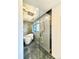 Elegant bathroom featuring a glass enclosed shower with rain shower head and a freestanding tub at 4192 S Vrain St, Denver, CO 80236
