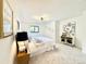 Inviting bedroom with plush carpeting, modern lighting, and a cozy reading nook for relaxation at 4192 S Vrain St, Denver, CO 80236