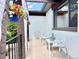 Inviting front porch with seating, plants, and neutral decor at 4192 S Vrain St, Denver, CO 80236