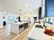 Spacious kitchen features a large island with a built-in microwave and a view into the living room at 4192 S Vrain St, Denver, CO 80236