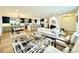 Open concept living room and kitchen with modern decor and lots of space for entertaining at 4192 S Vrain St, Denver, CO 80236