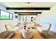 Bright and airy living room with exposed beams, a neutral color palette, and seamless flow to the outdoors at 4192 S Vrain St, Denver, CO 80236